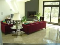 Light grey family room concrete floor